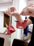 A participant of the Red Packet Decorations Workshop showing his lovely handmade decorations